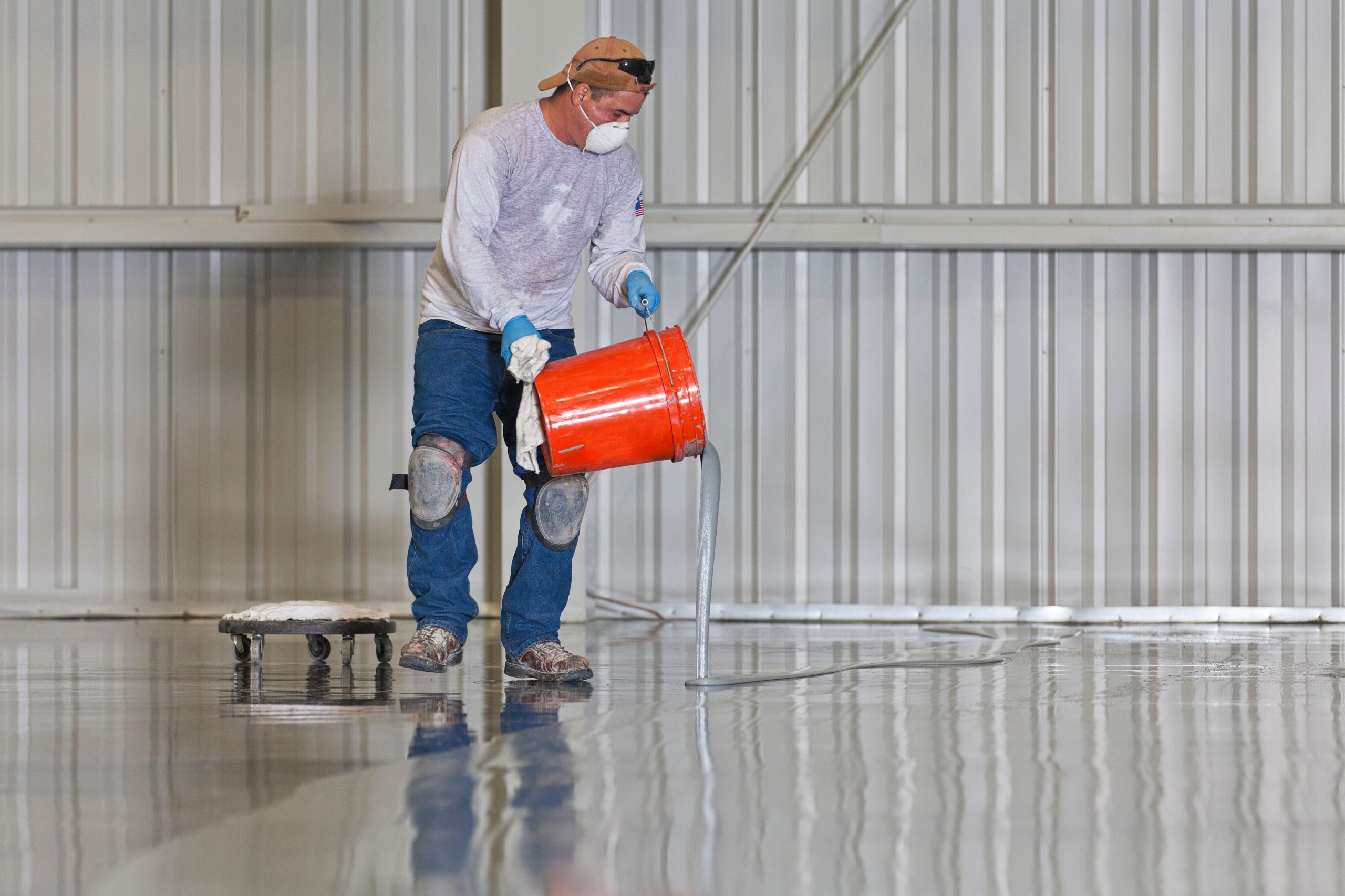 Applying coating to warehouse floor